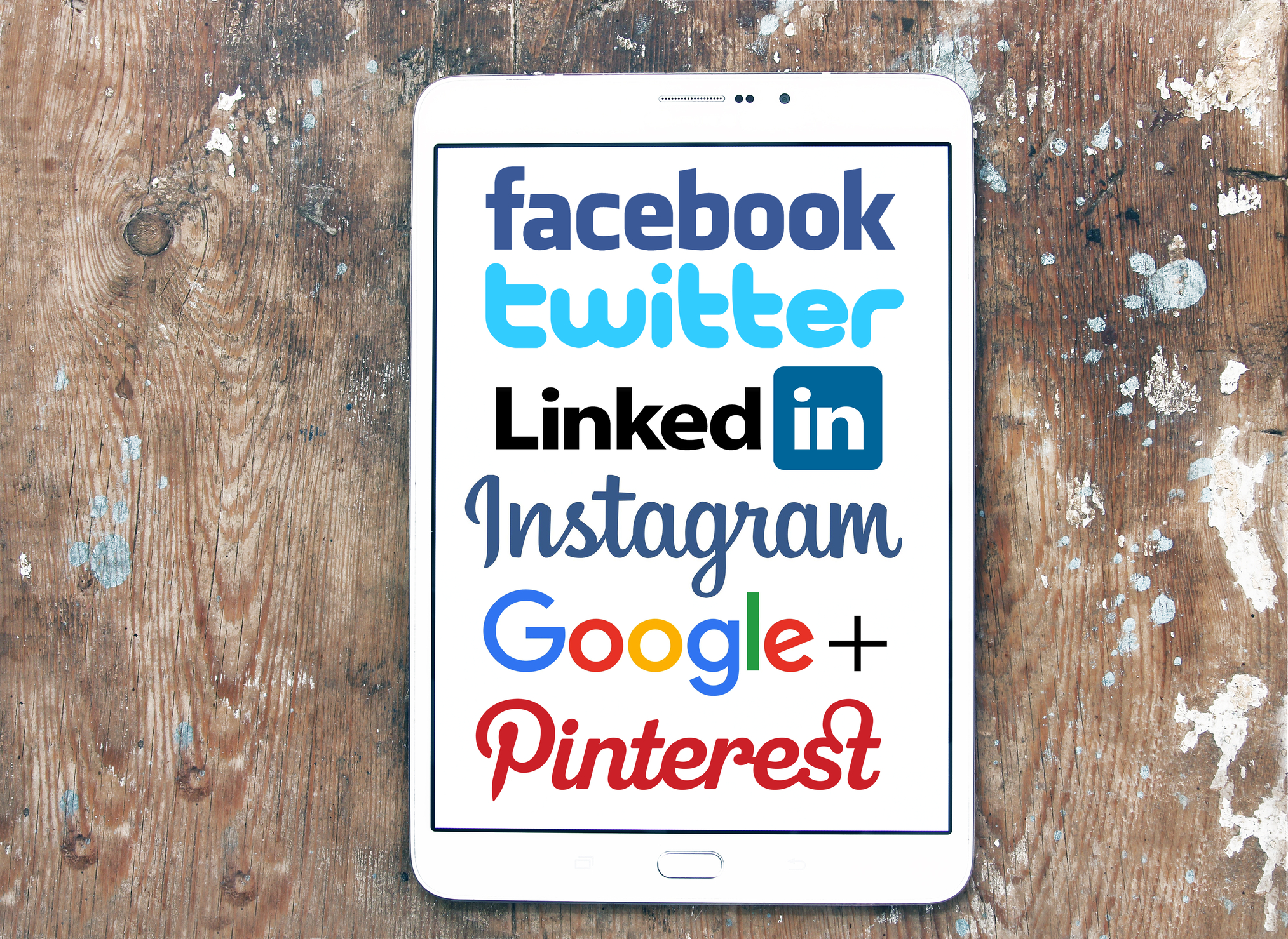 Tablet screen showcasing major social media platforms like Facebook, Twitter, LinkedIn, Instagram, and Pinterest, emphasizing digital marketing and online branding